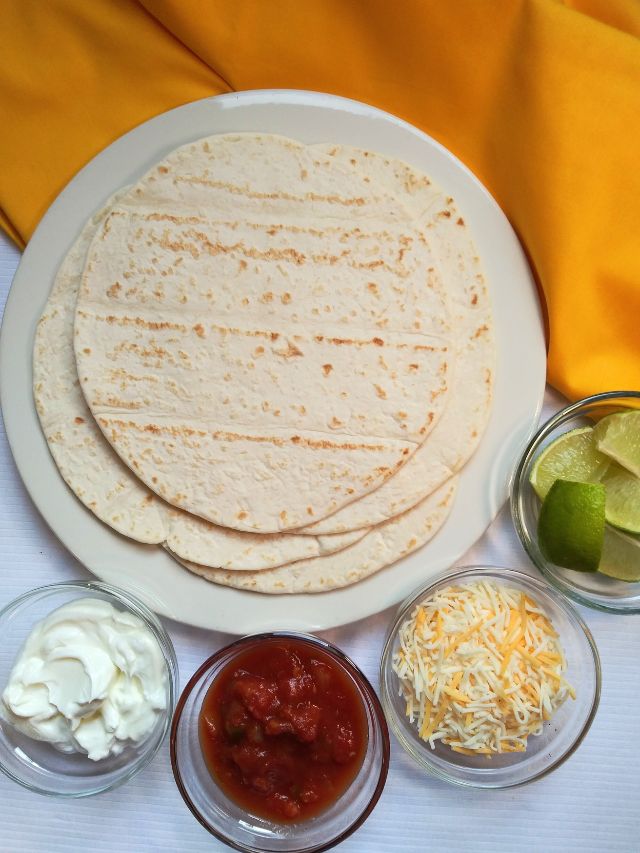 Flour tortillas and fajita toppings